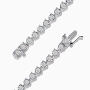 The Pave Classica 14K White Gold Diamond Bracelet features a single row of round, sparkling white diamonds in an oval shape, beautifully set against a white background.