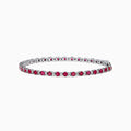 The 925 Sterling Silver Ruby and Diamond Tennis Bracelet features a continuous row of round rubies and diamonds set in individual prongs, forming an elegant circle for timeless sophistication.