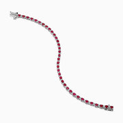 The 925 Sterling Silver Ruby and Diamond Tennis Bracelet features a continuous row of round rubies and diamonds set in individual prongs, forming an elegant circle for timeless sophistication.