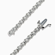 The 925 Silver Diamond Tennis Bracelet showcases a continuous line of sparkling diamond accents in prong settings, secured with a clasp and beautifully displayed against a white background.