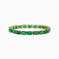 The Brasilica 14K Yellow Gold Emerald and Diamond Tennis Bracelet showcases a row of rectangular emeralds and sparkling diamonds set in prongs, forming an elegant, continuous design against a plain white background.