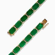 The Brasilica 14K Yellow Gold Emerald and Diamond Tennis Bracelet showcases a row of rectangular emeralds and sparkling diamonds set in prongs, forming an elegant, continuous design against a plain white background.