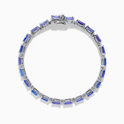 The Nahla 925 Silver Tanzanite and Diamond Tennis Bracelet showcases rectangular tanzanite gemstones and sparkling diamonds set in a graceful, continuous design.