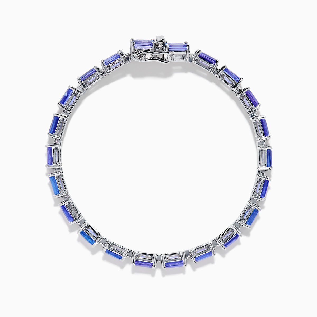 The Nahla 925 Silver Tanzanite and Diamond Tennis Bracelet showcases rectangular tanzanite gemstones and sparkling diamonds set in a graceful, continuous design.