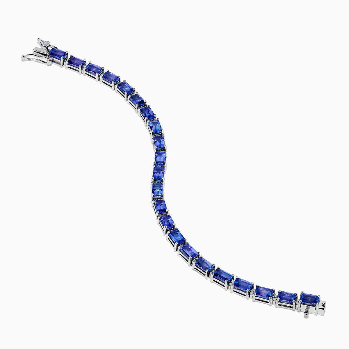The Nahla 925 Silver Tanzanite and Diamond Tennis Bracelet showcases rectangular tanzanite gemstones and sparkling diamonds set in a graceful, continuous design.
