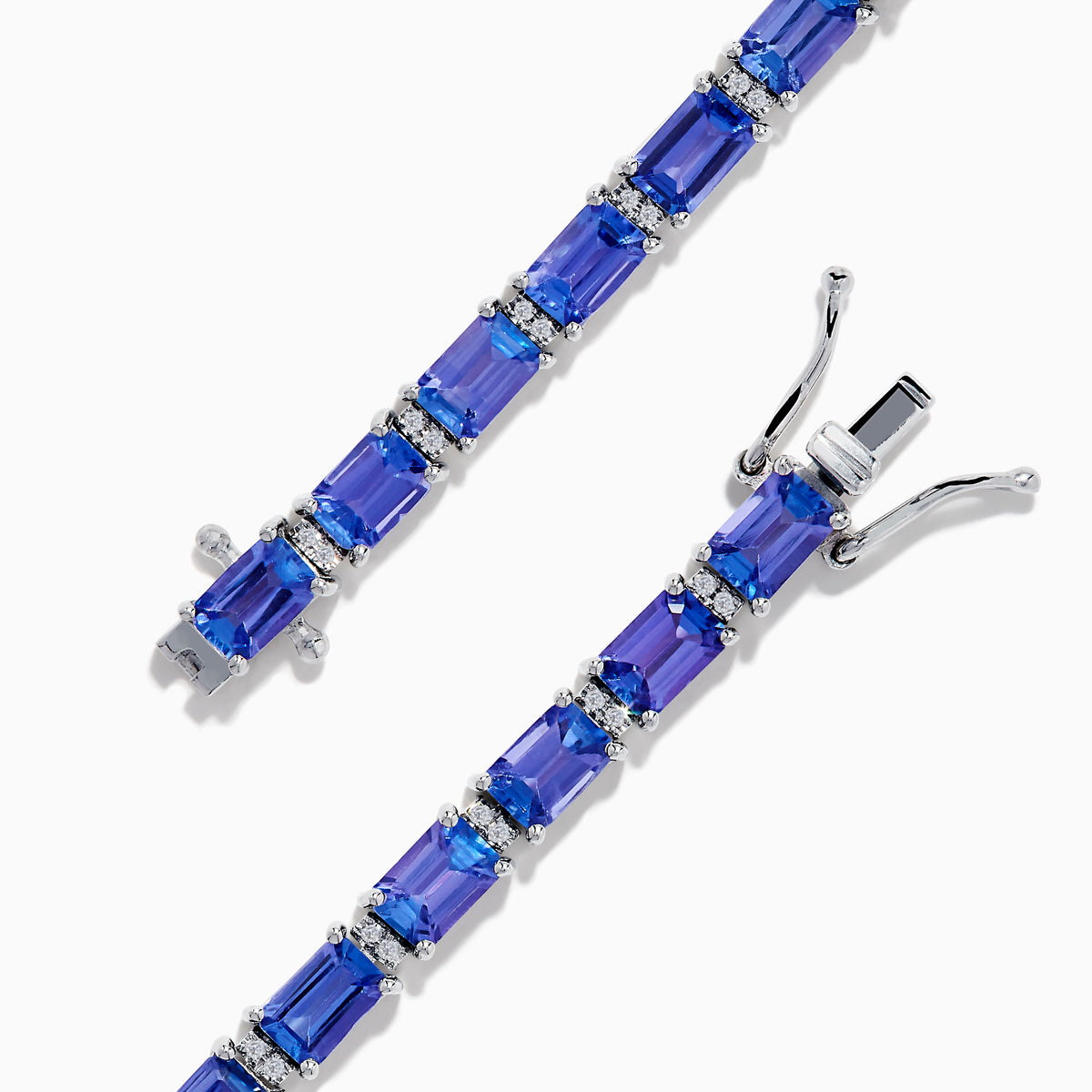 The Nahla 925 Silver Tanzanite and Diamond Tennis Bracelet showcases rectangular tanzanite gemstones and sparkling diamonds set in a graceful, continuous design.