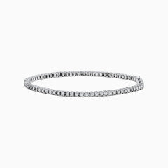 The 14K White Gold Diamond Tennis Bracelet 0.98 TCW features a slender band adorned with a continuous line of sparkling diamonds, beautifully displayed on a white background.