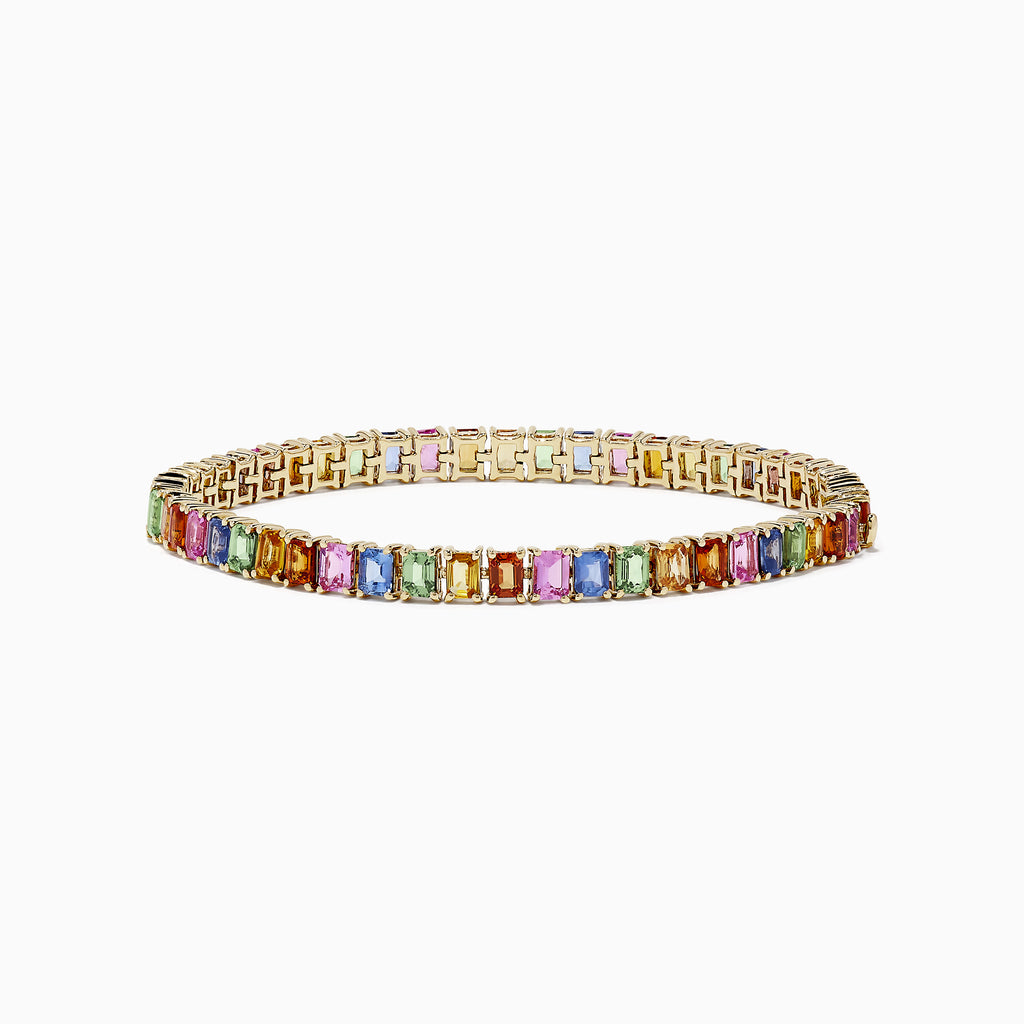 The Watercolor 14k Gold Emerald Cut Multi Sapphire Tennis Bracelet features a continuous row of vibrant, multicolored sapphires set in elegant 14k gold.