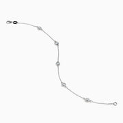The 14K White Gold Bezel Diamond Bezel Bracelet features five round diamond-like stones in bezel settings, evenly spaced along a delicate chain, and secured with a lobster clasp.