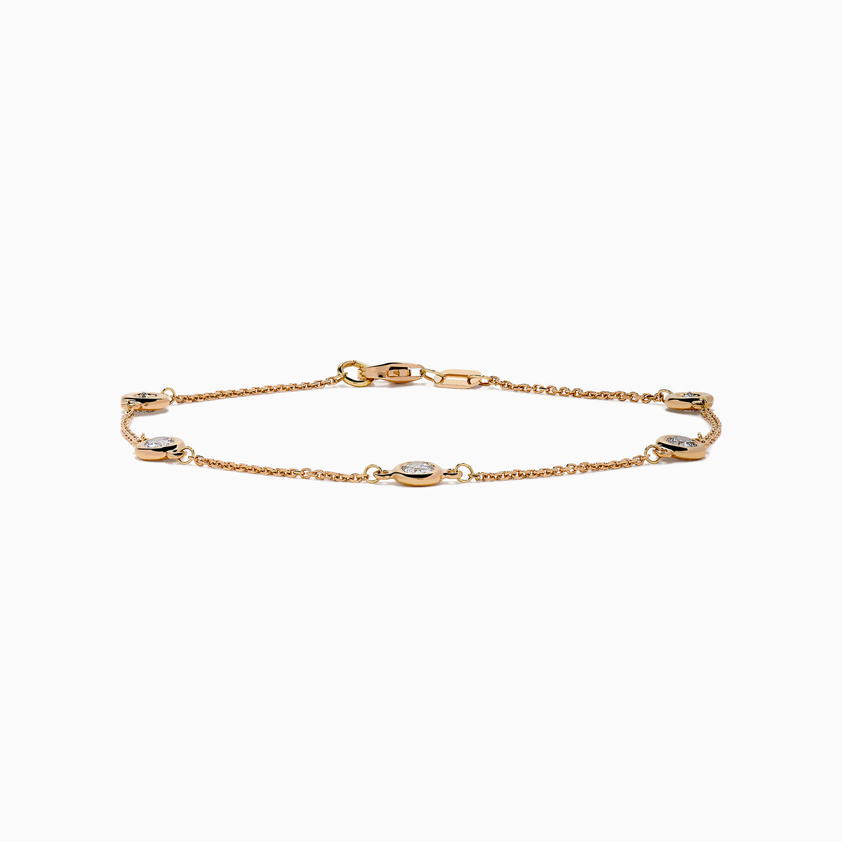 The Pave Rose 14K Rose Gold Diamond Station Bracelet features five round diamonds in gold bezels on a delicate chain with a lobster clasp, shown on a white background.