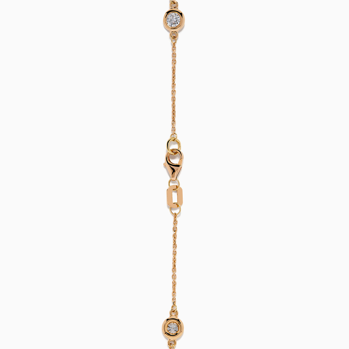 The Pave Rose 14K Rose Gold Diamond Station Bracelet features five round diamonds in gold bezels on a delicate chain with a lobster clasp, shown on a white background.