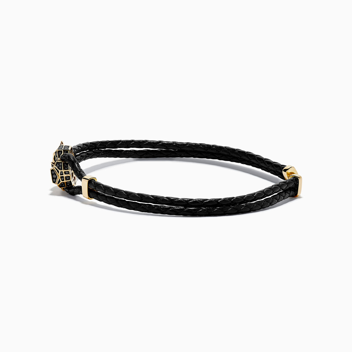 A black braided leather bracelet featuring a signature 14K yellow gold panther center with black diamond and tsavorite accents, finished with a gold clasp for men.