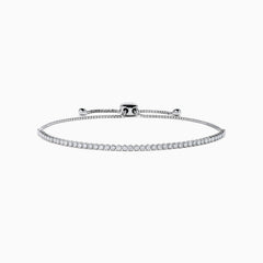 The 14K White Gold Pave Diamond Bolo Bracelet features a row of sparkling diamonds and a sliding clasp, elegantly displayed on a white background.