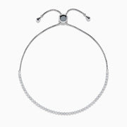 The 14K White Gold Pave Diamond Bolo Bracelet features a row of sparkling diamonds and a sliding clasp, elegantly displayed on a white background.