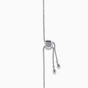 The 14K White Gold Pave Diamond Bolo Bracelet features a row of sparkling diamonds and a sliding clasp, elegantly displayed on a white background.