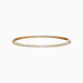 The 14K Yellow Gold Diamond Tennis Bracelet 2.33TCW, featuring a continuous row of sparkling round white diamonds, is elegantly shown on a simple white background.