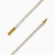 The 14K Yellow Gold Diamond Tennis Bracelet 2.33TCW, featuring a continuous row of sparkling round white diamonds, is elegantly shown on a simple white background.