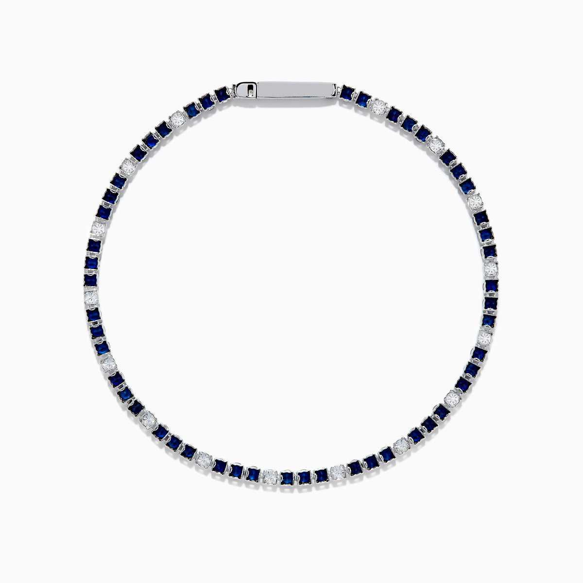 The Royale Bleu 14K White Gold Tennis Bracelet features alternating round blue sapphires and diamonds set in a slim band with a simple clasp, shown on a white background.