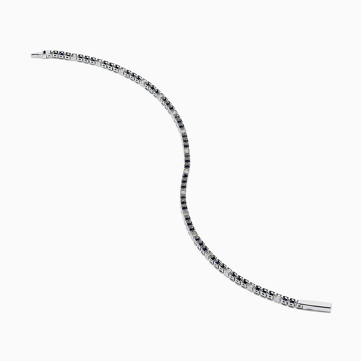 The Royale Bleu 14K White Gold Tennis Bracelet features alternating round blue sapphires and diamonds set in a slim band with a simple clasp, shown on a white background.