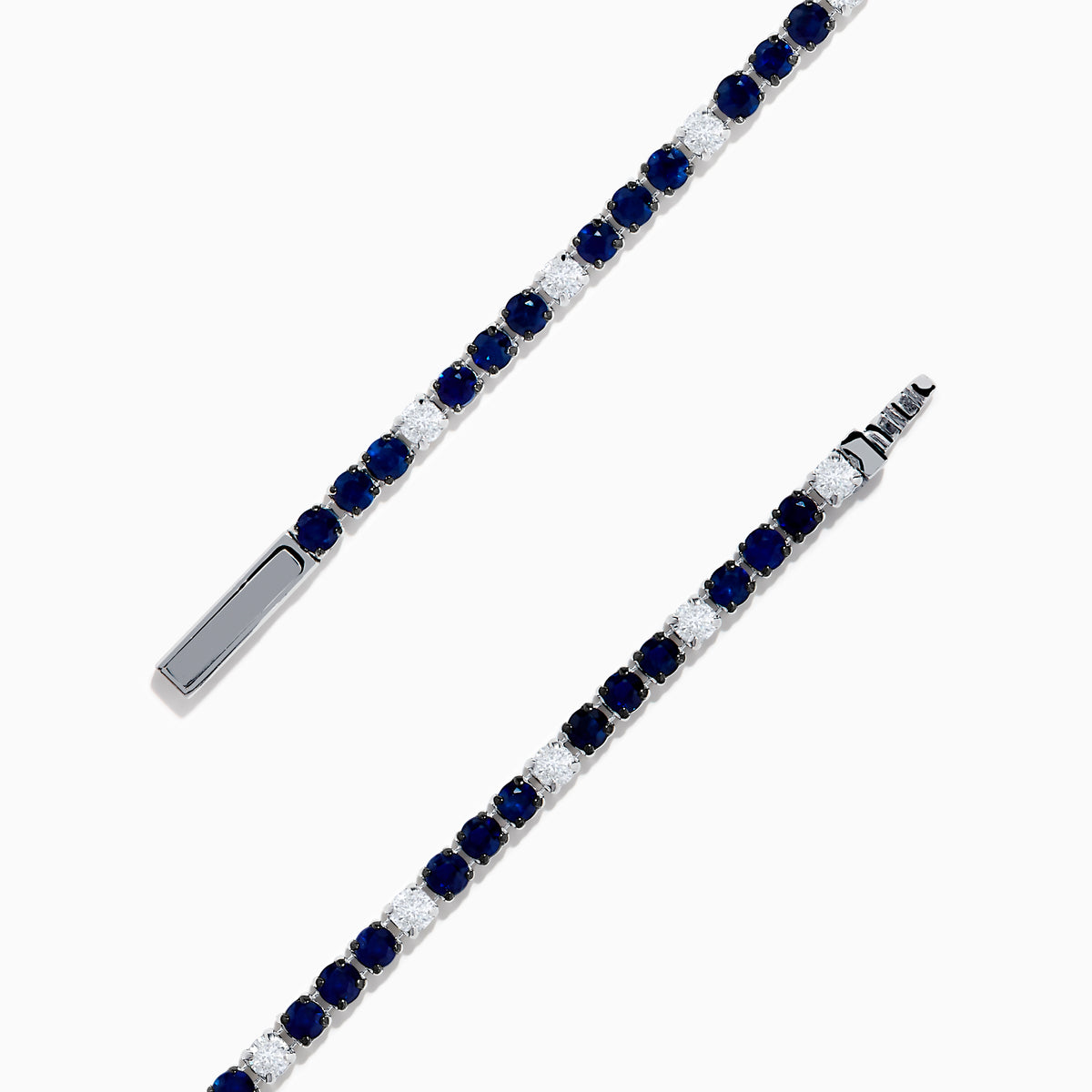 The Royale Bleu 14K White Gold Tennis Bracelet features alternating round blue sapphires and diamonds set in a slim band with a simple clasp, shown on a white background.