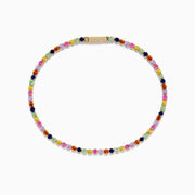 The Watercolors 14K Yellow Gold Multi Sapphire Tennis Bracelet features a single row of small, round, multicolored sapphires in a repeating pattern, displayed on a white background.