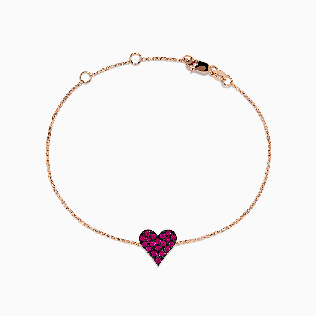 The 14K Rose Gold Pave Ruby Heart Bracelet features a delicate chain with a central heart-shaped charm set with rubies and secured by a lobster clasp.