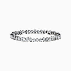 The 14K White Gold Fancy Cut Diamond Miracle Set Bracelet features alternating oval, pear, and emerald-cut diamonds in a continuous pattern against a white gold background.