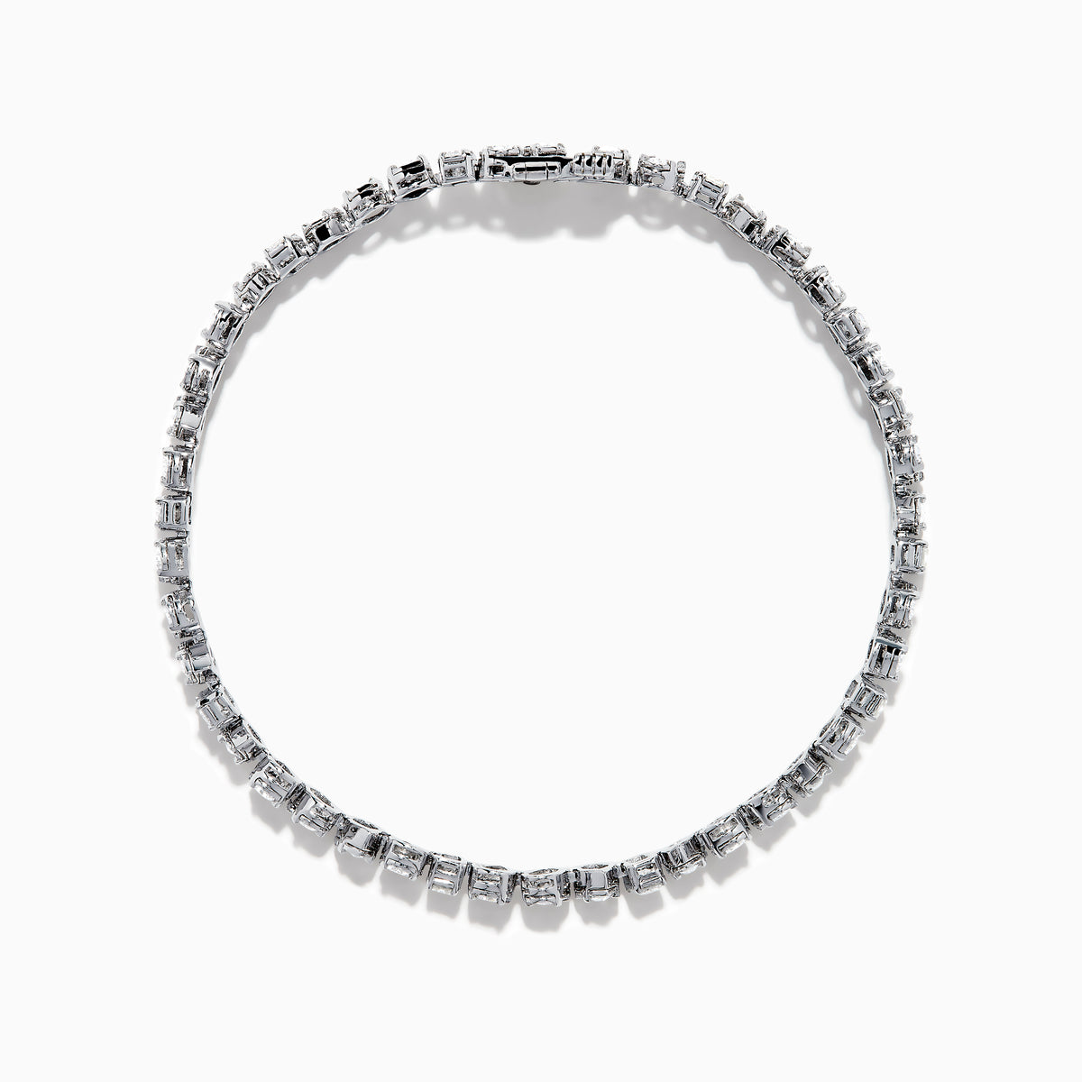 The 14K White Gold Fancy Cut Diamond Miracle Set Bracelet features alternating oval, pear, and emerald-cut diamonds in a continuous pattern against a white gold background.
