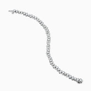 The 14K White Gold Fancy Cut Diamond Miracle Set Bracelet features alternating oval, pear, and emerald-cut diamonds in a continuous pattern against a white gold background.