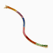 The Watercolors 14K Yellow Gold Multi Sapphire Marquise Tennis Bracelet showcases marquise-cut sapphires in a vibrant blue, purple, pink, orange, and yellow gradient set in one elegant row.