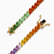 The Watercolors 14K Yellow Gold Multi Sapphire Marquise Tennis Bracelet showcases marquise-cut sapphires in a vibrant blue, purple, pink, orange, and yellow gradient set in one elegant row.