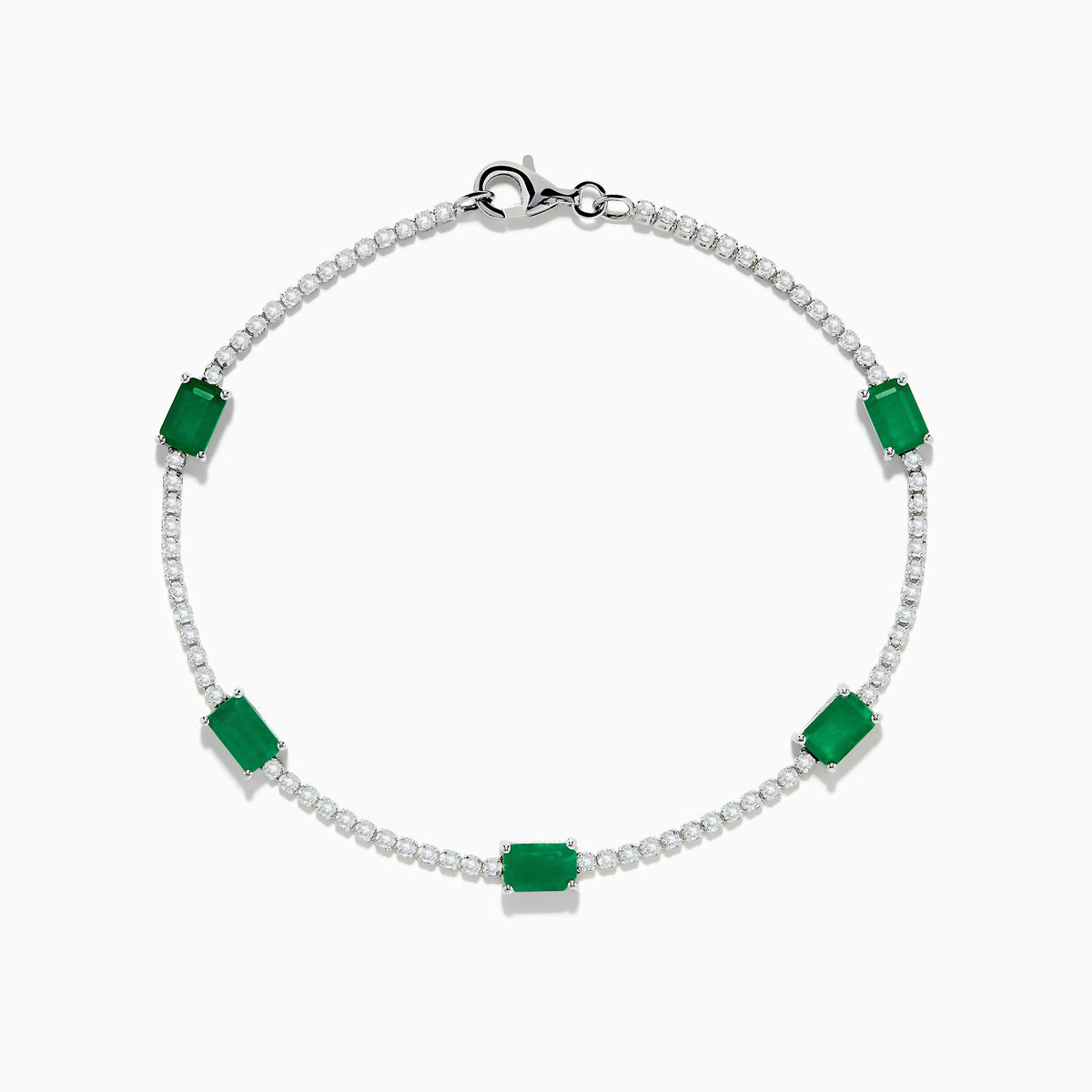 The 14K White Gold Emerald and Diamond Tennis Bracelet features a silver chain with small round white stones and five evenly spaced rectangular emeralds, displayed on a white background.