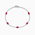 The Ruby Royale 14K White Gold Ruby and Diamond Tennis Bracelet features a thin strand of white diamonds with five marquise-shaped rubies and a silver clasp, displayed on a white background.