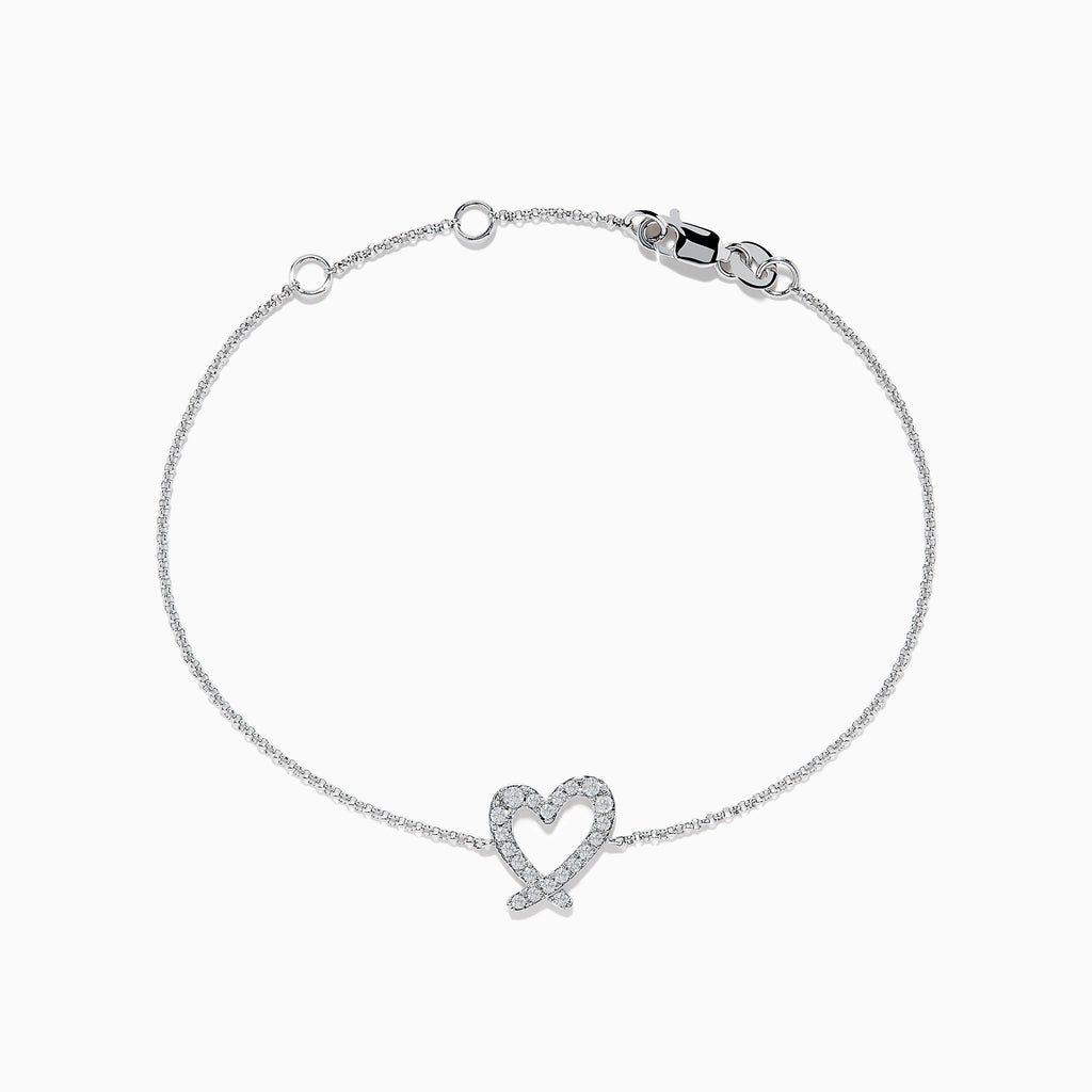 The Novelty 14K White Gold Heart Bracelet features a thin chain, a diamond-accented heart centerpiece, and a secure lobster clasp closure.