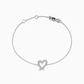 The Novelty 14K White Gold Heart Bracelet features a thin chain, a diamond-accented heart centerpiece, and a secure lobster clasp closure.