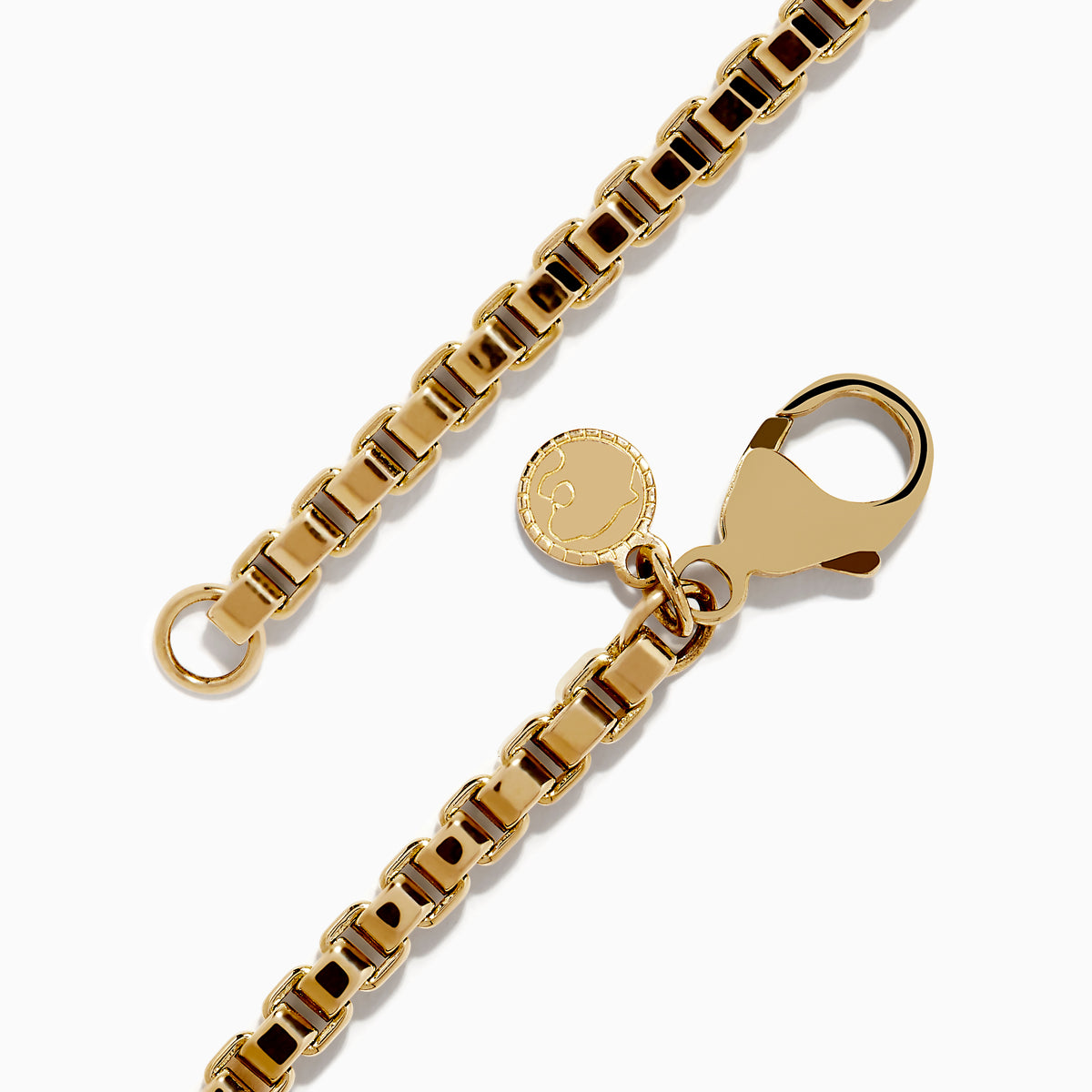 The Mens 14K Yellow Gold Chain Bracelet 8.5 features a classic box chain, lobster clasp, and a small round charm, showcased on a white background.