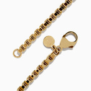 The Mens 14K Yellow Gold Chain Bracelet 8.5 features a classic box chain, lobster clasp, and a small round charm, showcased on a white background.