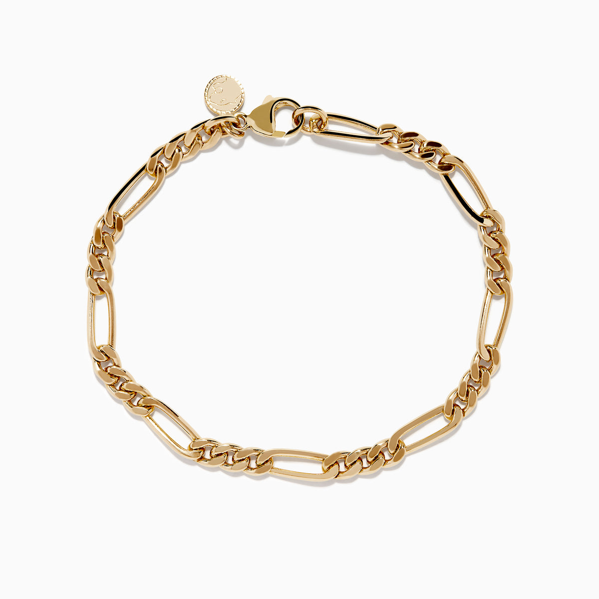 The Mens 14K Yellow Gold Figaro Chain Bracelet features elongated, interlocking links and a small round charm near the clasp, displayed on a white background.