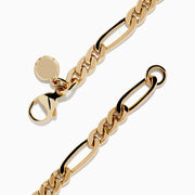 The Mens 14K Yellow Gold Figaro Chain Bracelet features elongated, interlocking links and a small round charm near the clasp, displayed on a white background.