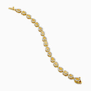 The Canare 18K Yellow Gold Yellow and White Diamond Bracelet features alternating teardrop and oval links with yellow gemstones accented by white diamonds, shown on a white background.