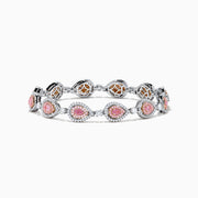 The 18K Two-Tone Gold Pink and White Diamond Tennis Bracelet features alternating teardrop-shaped settings with pink and white diamonds accented by small clear stones, shown on a white background.