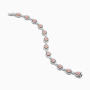 The 18K Two-Tone Gold Pink and White Diamond Tennis Bracelet features alternating teardrop-shaped settings with pink and white diamonds accented by small clear stones, shown on a white background.