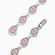 The 18K Two-Tone Gold Pink and White Diamond Tennis Bracelet features alternating teardrop-shaped settings with pink and white diamonds accented by small clear stones, shown on a white background.