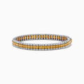 The Canare 18K Two Tone Gold White & Yellow Diamond Bracelet, showcasing a central row of yellow diamonds bordered by clear stones, is elegantly displayed on a white background.