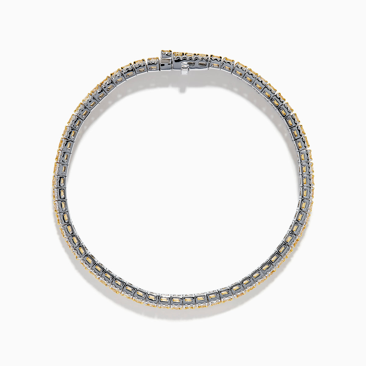 The Canare 18K Two Tone Gold White & Yellow Diamond Bracelet, showcasing a central row of yellow diamonds bordered by clear stones, is elegantly displayed on a white background.