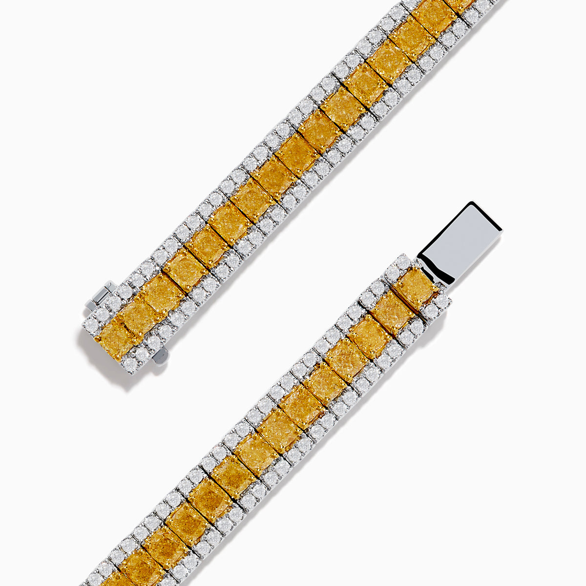 The Canare 18K Two Tone Gold White & Yellow Diamond Bracelet, showcasing a central row of yellow diamonds bordered by clear stones, is elegantly displayed on a white background.