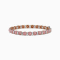 The 18K Two Tone White & Pink Diamond Bracelet features alternating clusters of pink and white diamonds in a repeating pattern around the entire band, beautifully set against a white background.