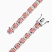The 18K Two Tone White & Pink Diamond Bracelet features alternating clusters of pink and white diamonds in a repeating pattern around the entire band, beautifully set against a white background.
