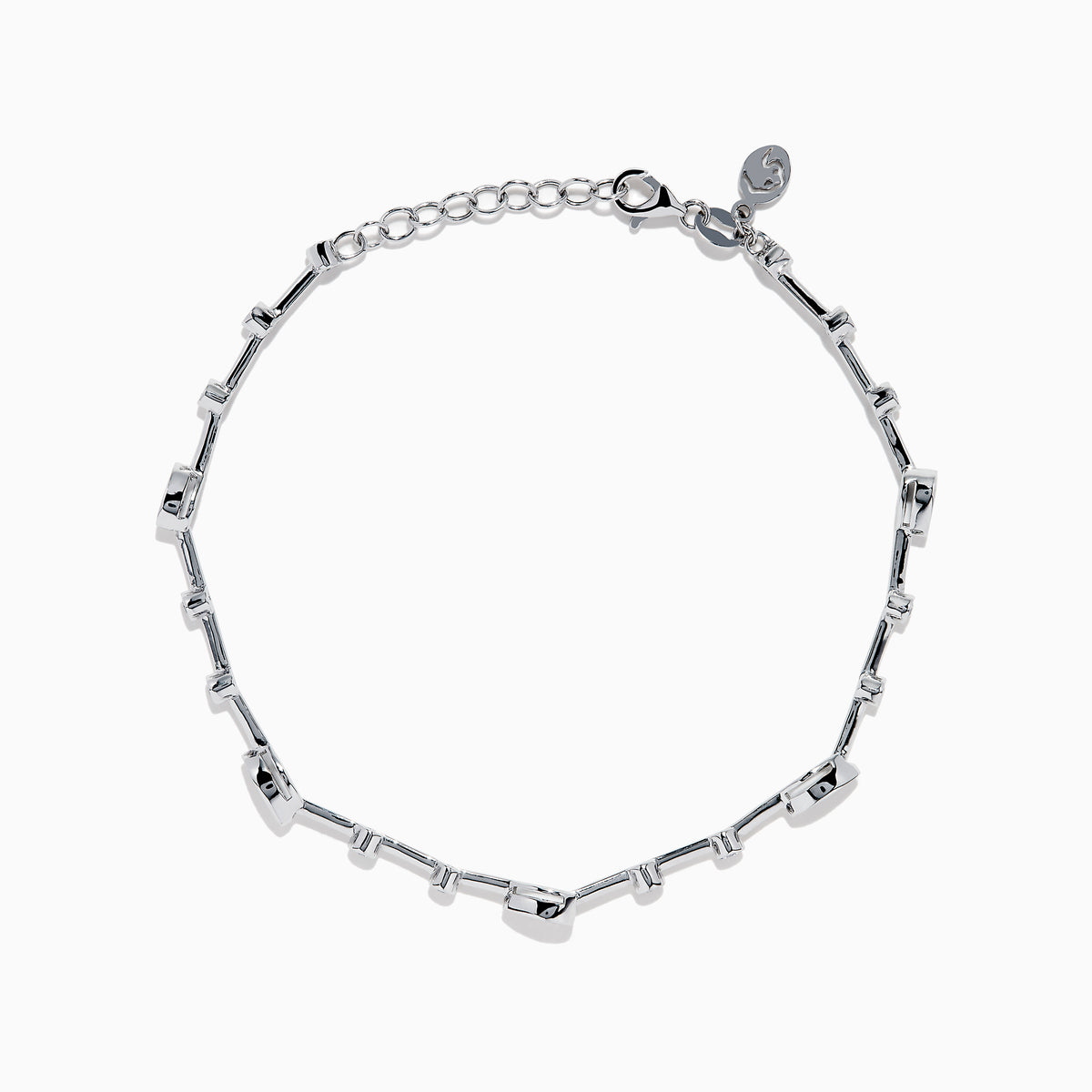 The 14K White Gold Diamond Station Bracelet features small round and teardrop-shaped diamonds spaced along a thin chain, showcased on a white background.