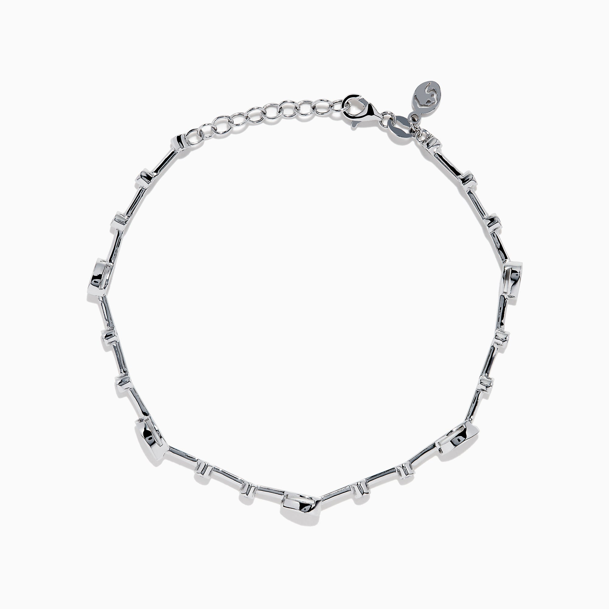 The 14K White Gold Diamond Station Bracelet features small round and teardrop-shaped diamonds spaced along a thin chain, showcased on a white background.